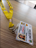 ID card holder with yellow lanyard and student ID card in use